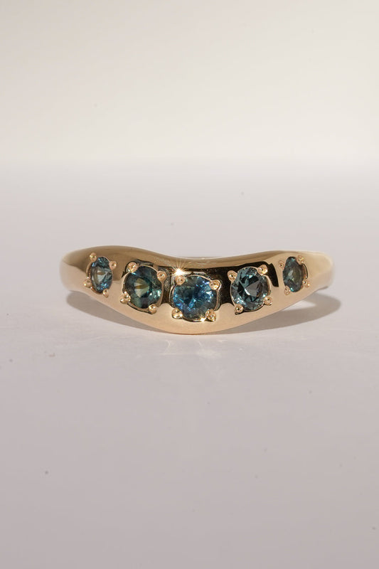 Solid gold teal sapphire stacking band