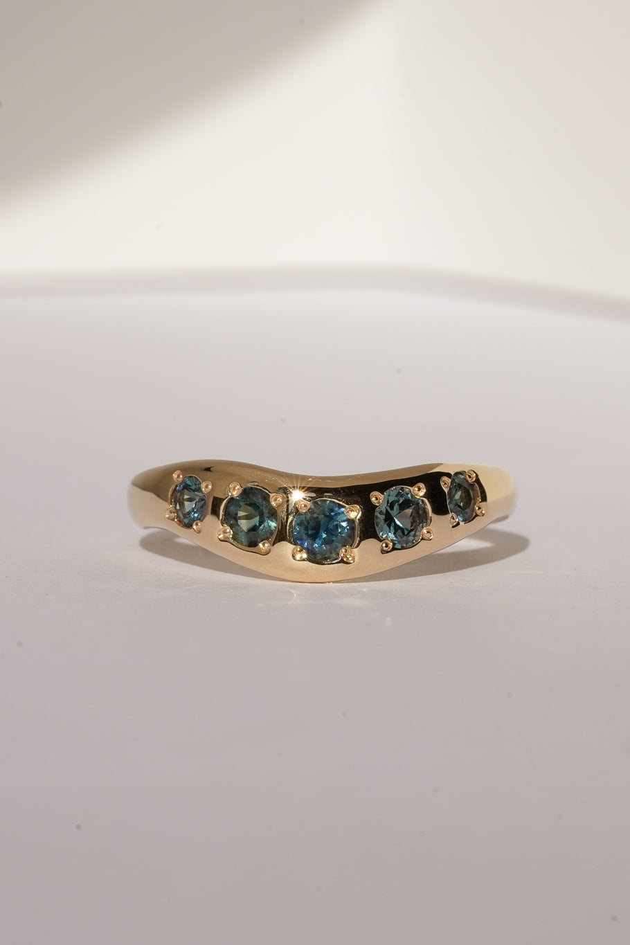 Solid gold teal sapphire stacking band