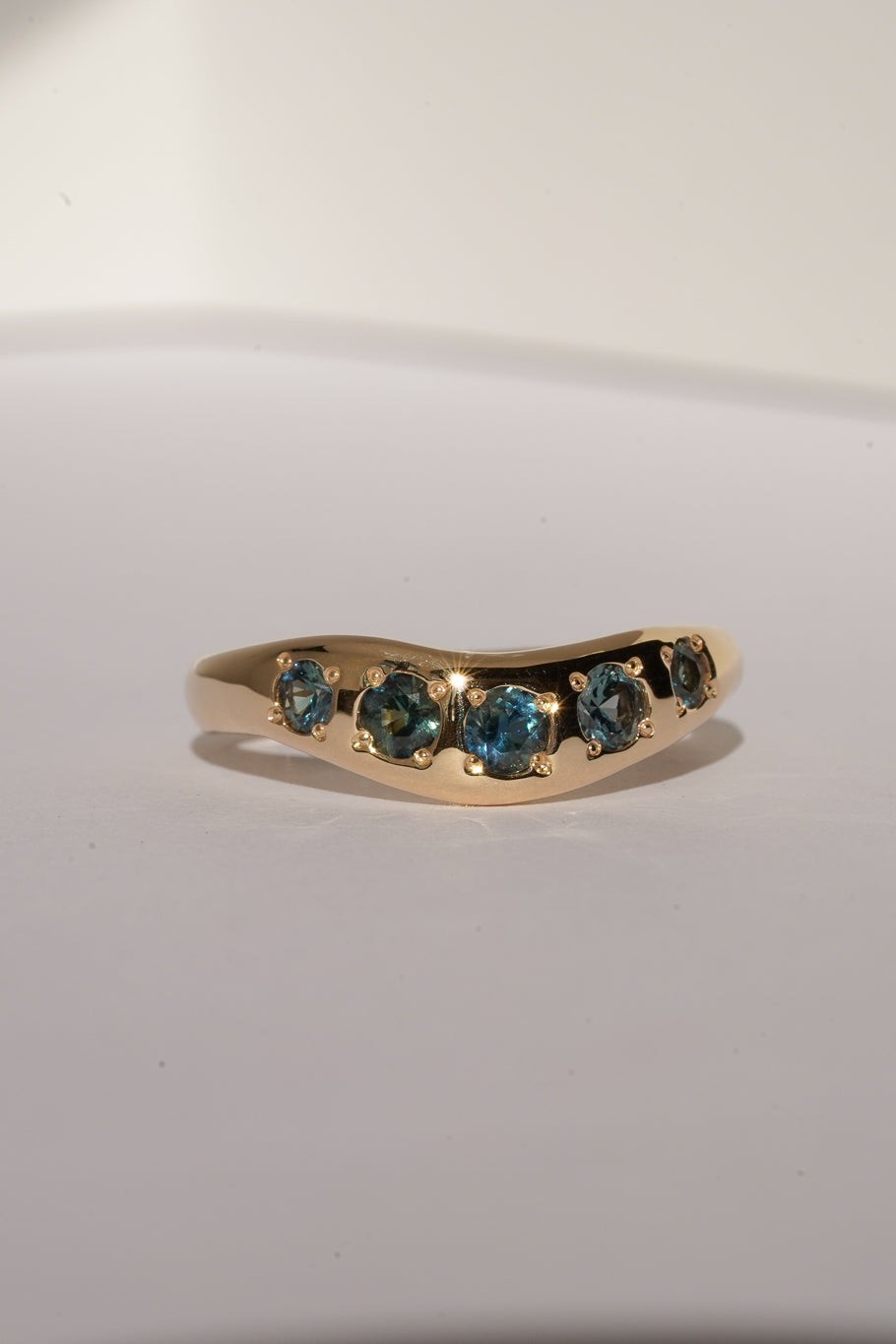 Solid gold teal sapphire stacking band