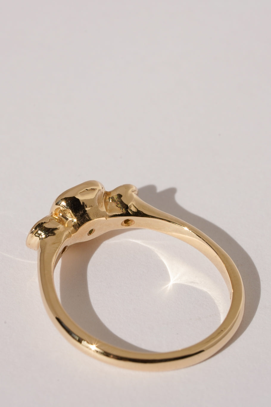 Solid gold green sapphire trilogy ring