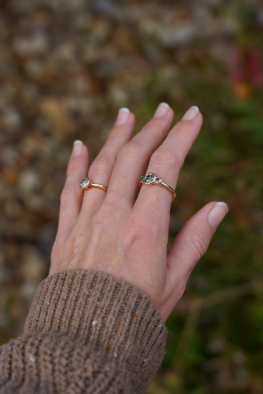 Solid gold green sapphire trilogy ring