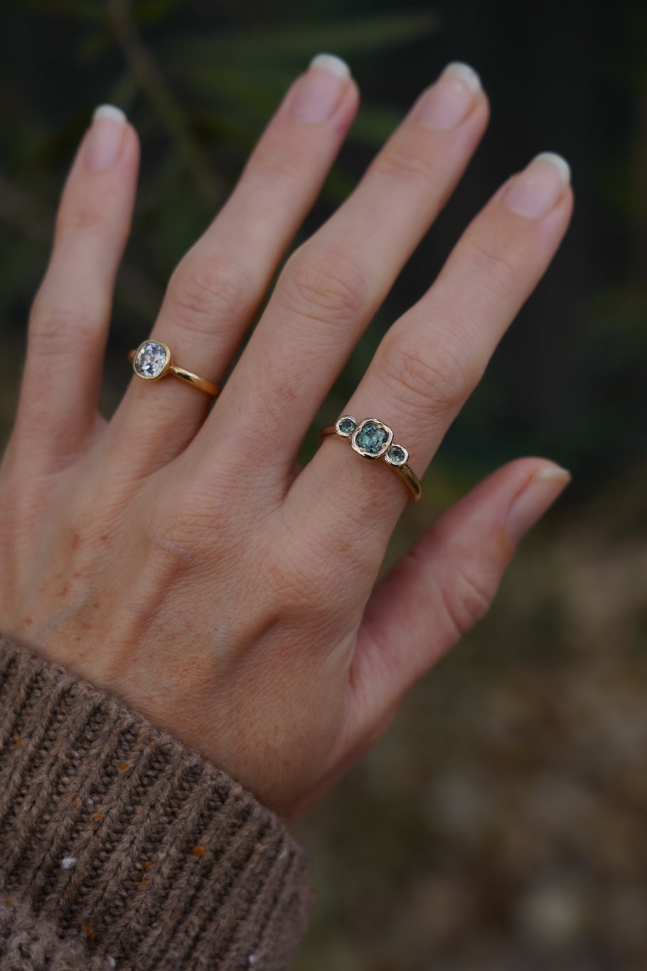 Solid gold green sapphire trilogy ring
