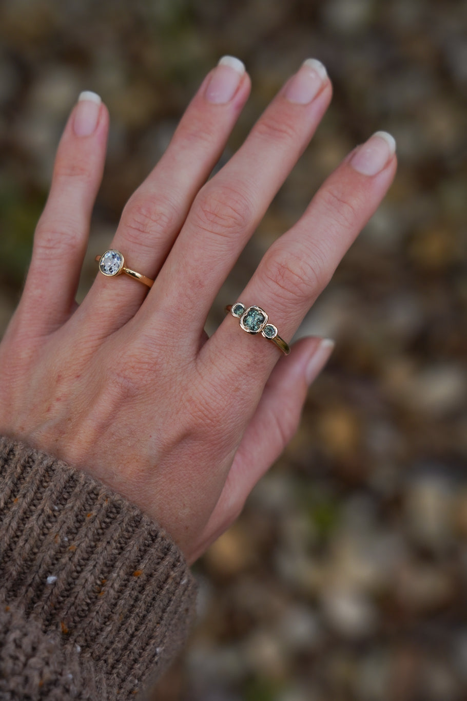 Solid gold green sapphire trilogy ring
