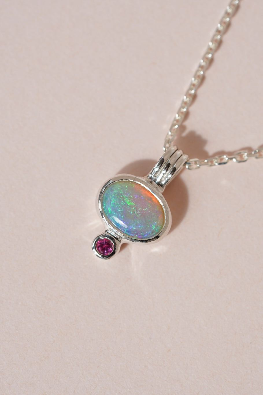 Blue crystal opal and ruby pendant