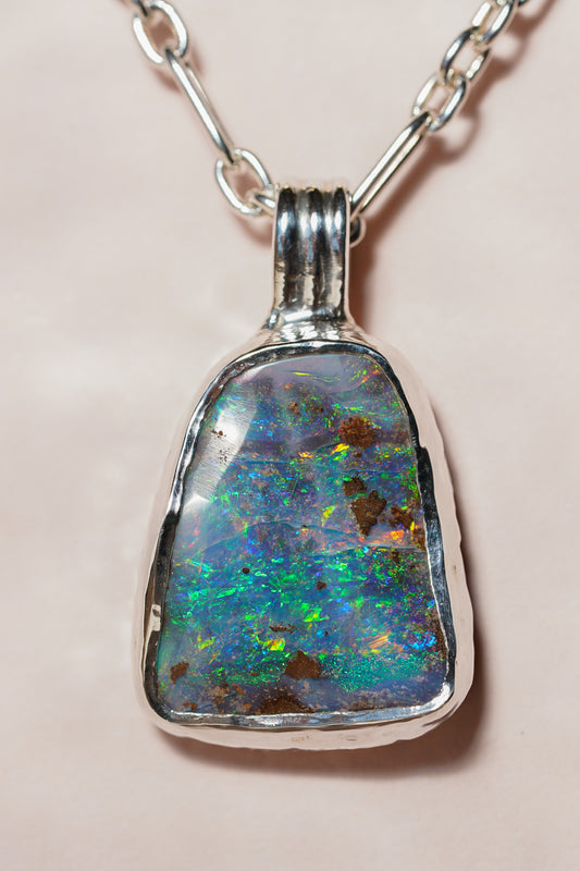 Large blue boulder opal pendant