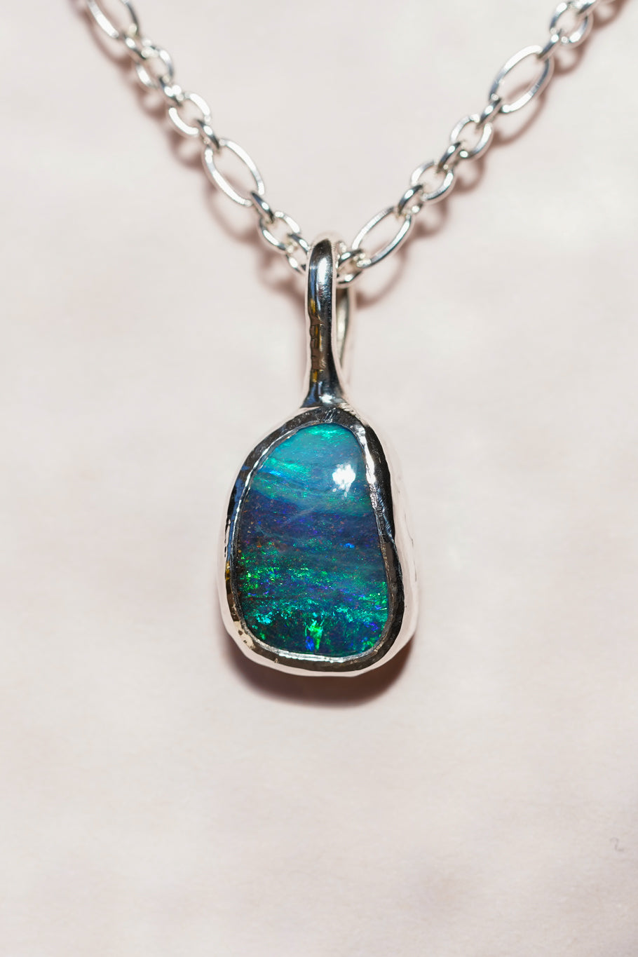 Deep blue boulder opal pendant
