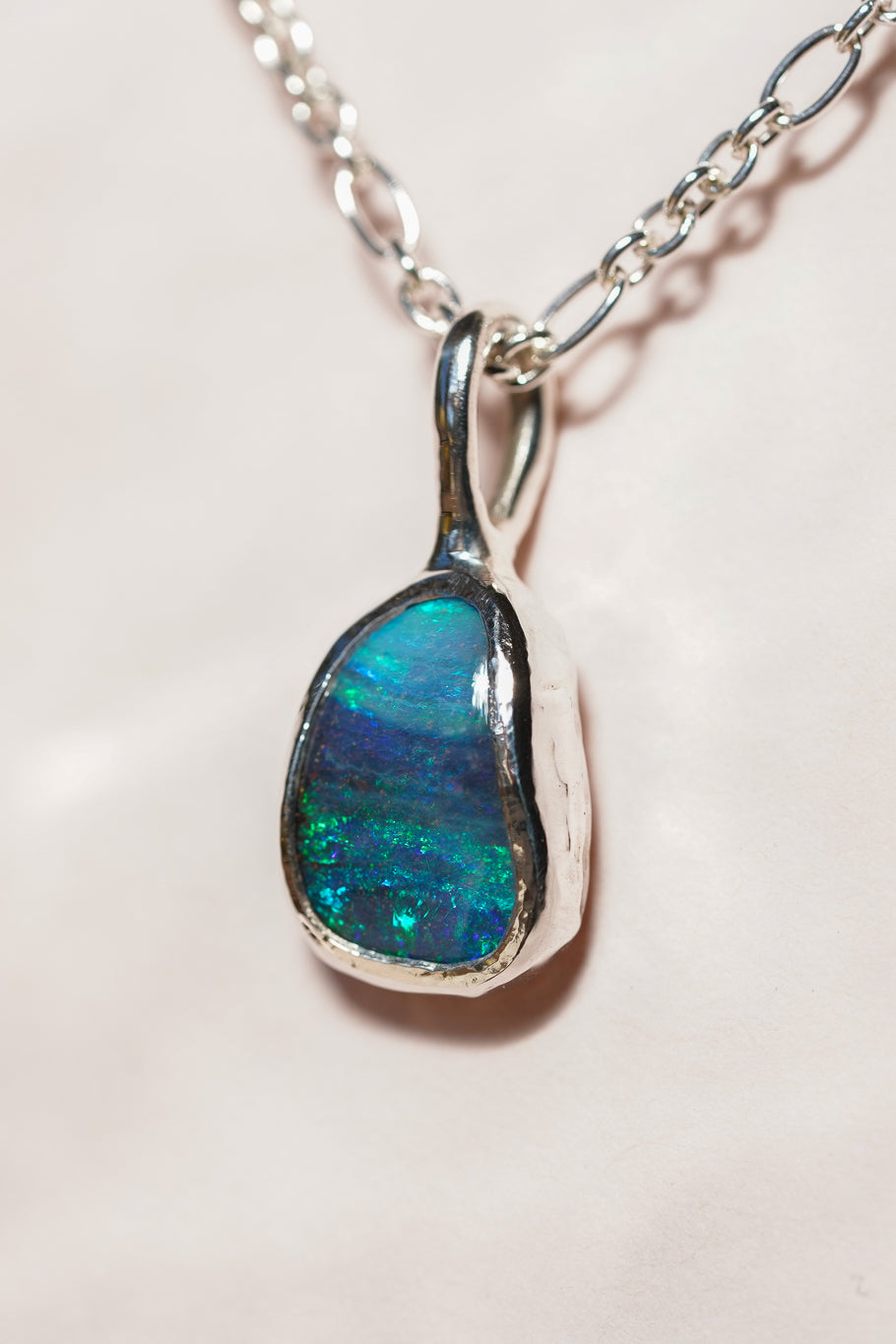 Deep blue boulder opal pendant