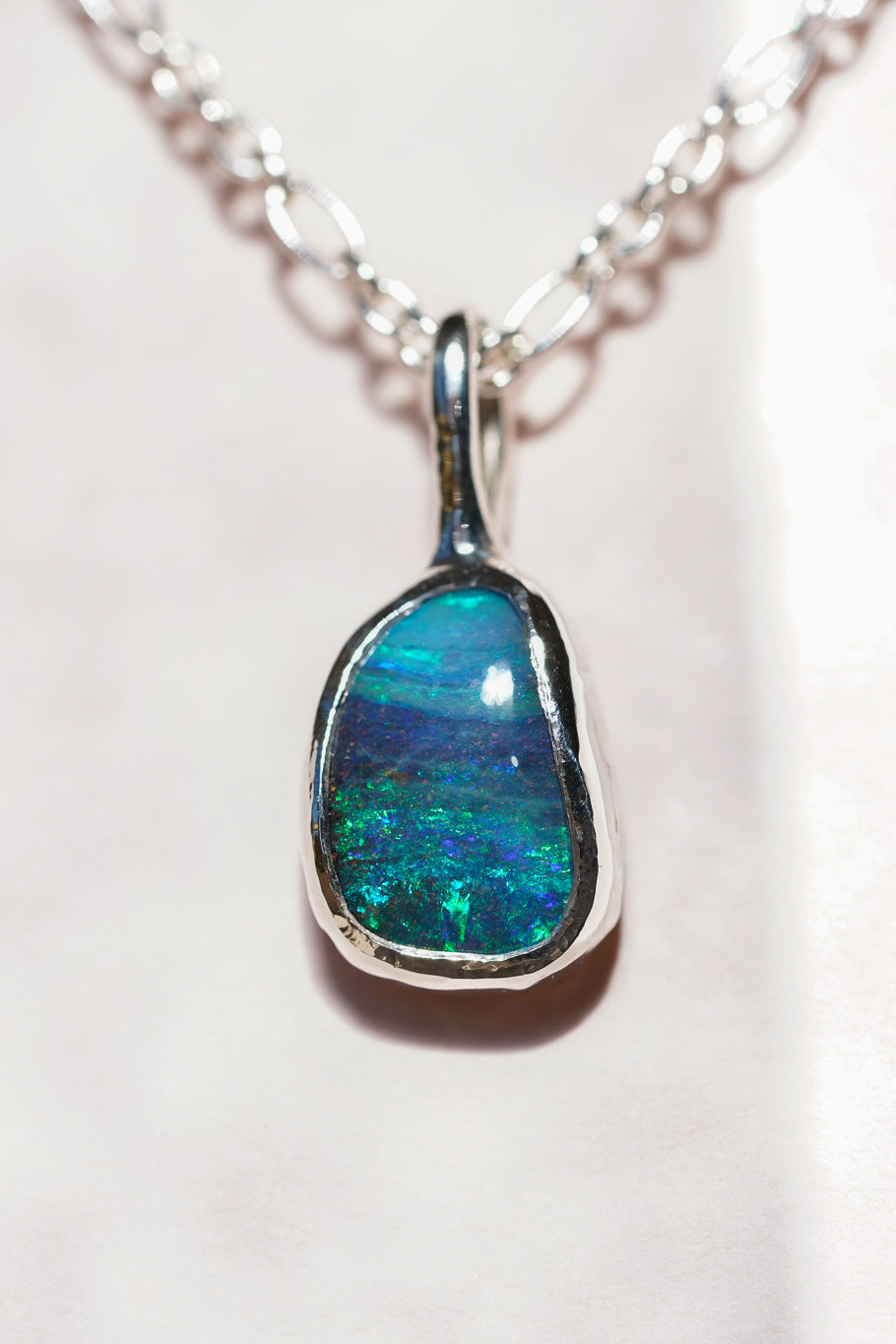 Deep blue boulder opal pendant