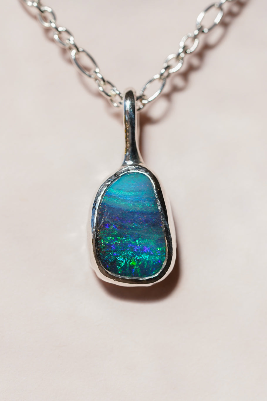 Deep blue boulder opal pendant