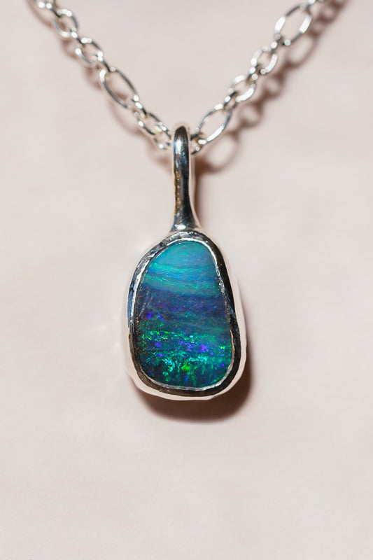 Deep blue boulder opal pendant