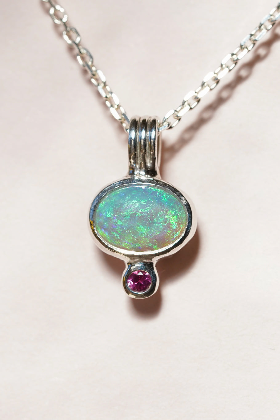 Blue crystal opal and ruby pendant