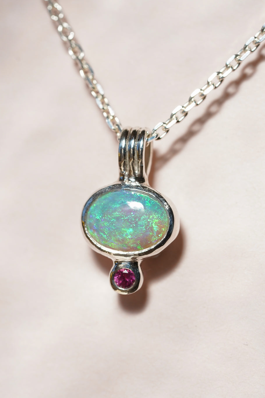 Blue crystal opal and ruby pendant