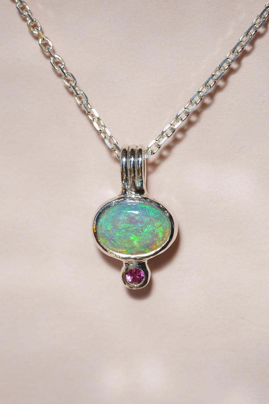Blue crystal opal and ruby pendant