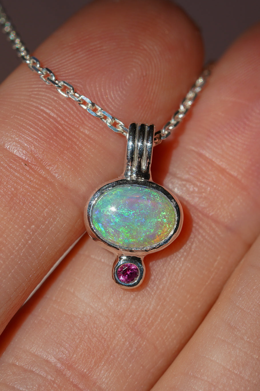 Blue crystal opal and ruby pendant