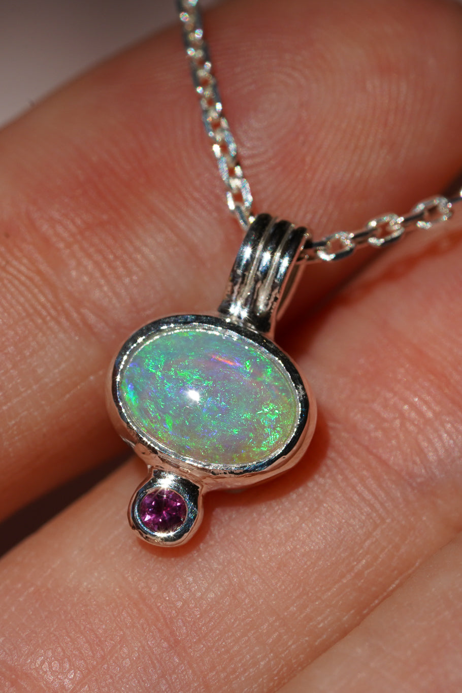 Blue crystal opal and ruby pendant