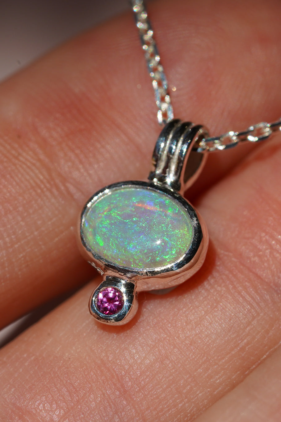 Blue crystal opal and ruby pendant