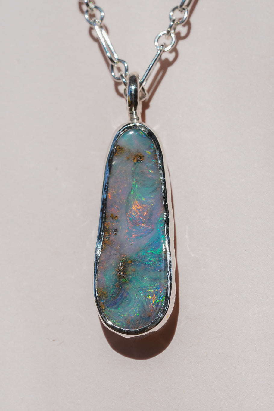 Pink & blue boulder opal pendant