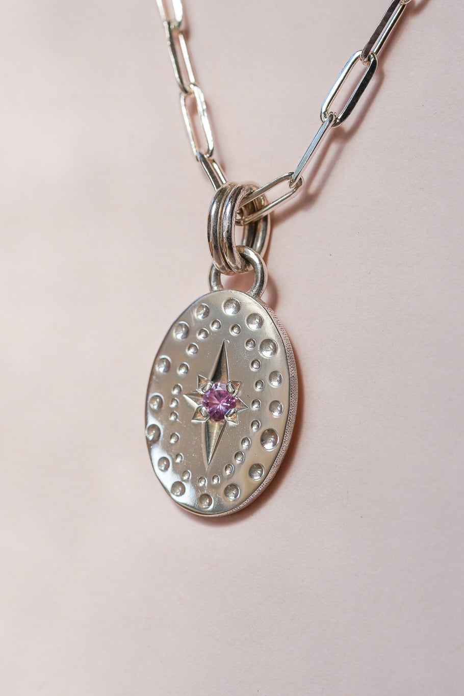 Classic oval pendant with pink sapphire