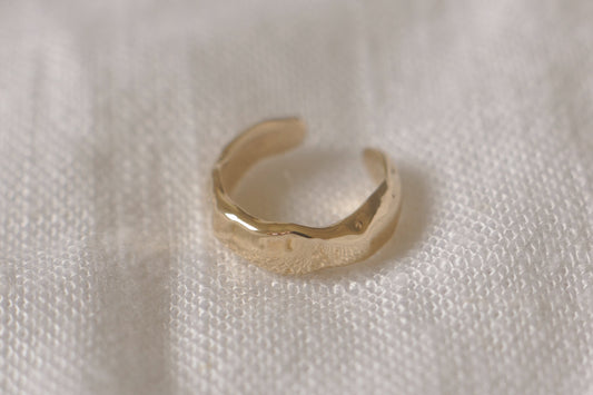 Solid gold molten ear cuff