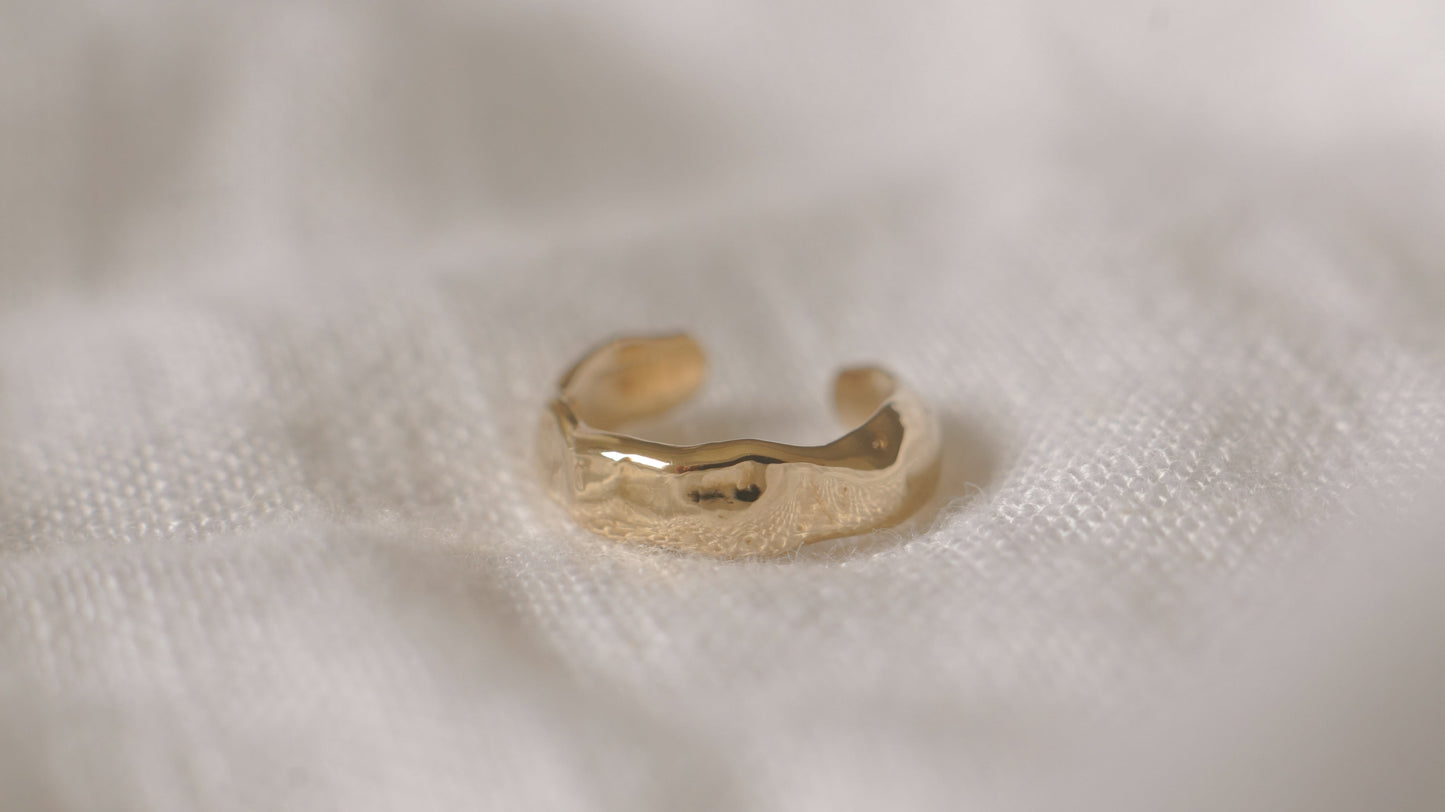 Solid gold molten ear cuff