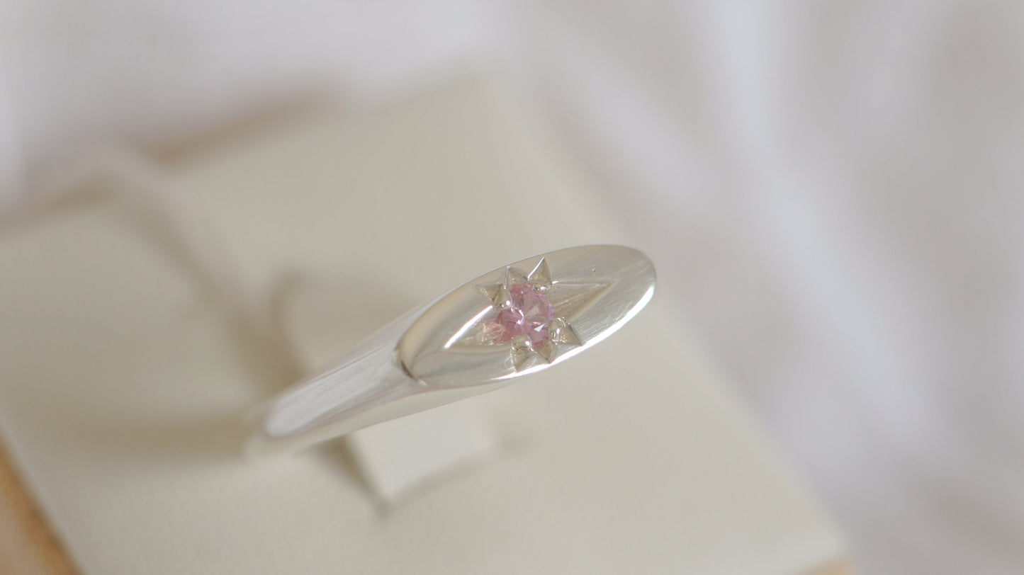 Slim oval signet with pink sapphire